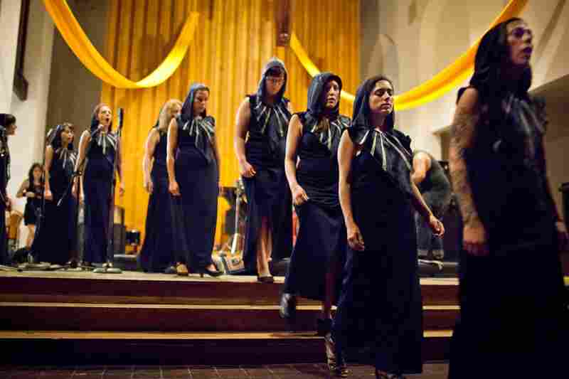 Just as they entered through the center of the church singing, the members of the Assembly of Light Choir walk back to end the performance.