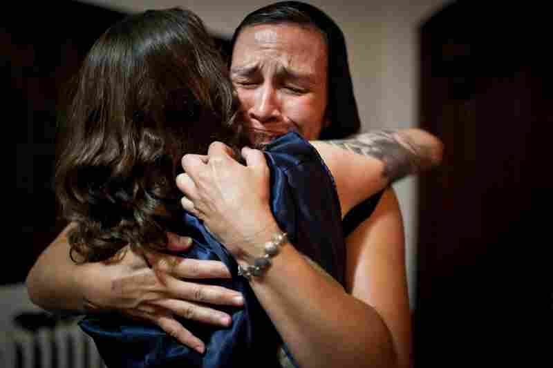Caitlin Johnston of Providence, R.I., hugs Wolpert after their performance.