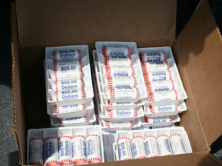 A box of dollar coins ordered from the U.S. Mint.