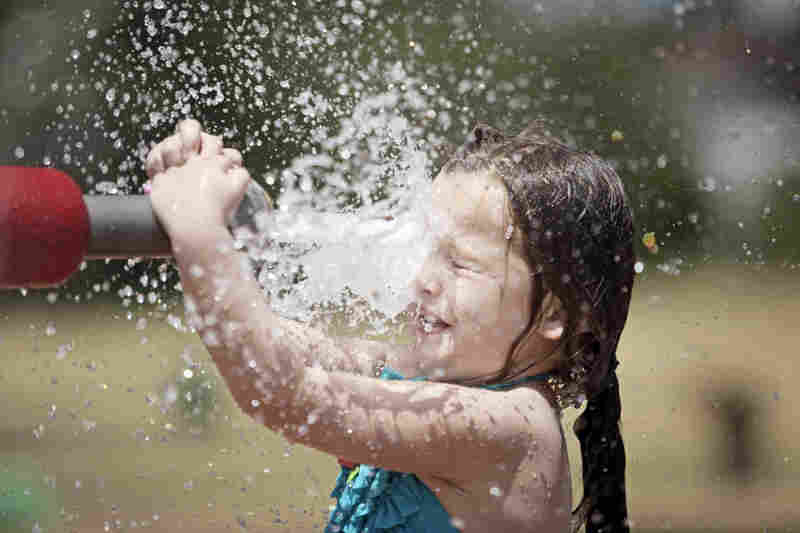 Hanna Hammond, 4, plays at the public sprayground at Memorial Park on Thursday in Oklahoma City, Okla. 
