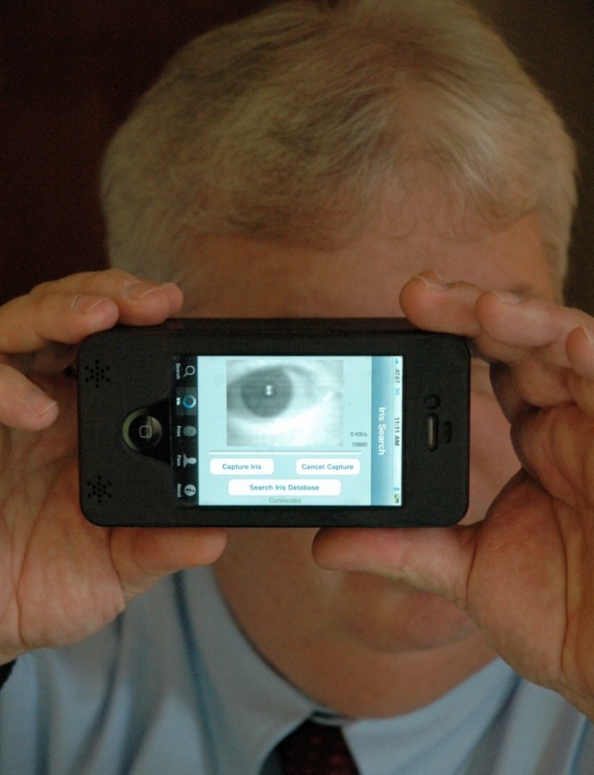 Sean Mullin, CEO of BI2 Technologies, scans his own eye with the MORIS, or Mobile Offender Recognition and Information System. The device attaches to an iPhone and allows police in the field to scan a person's iris, face or fingerprint and then check it against a database to verify his or her identity. (NPR)