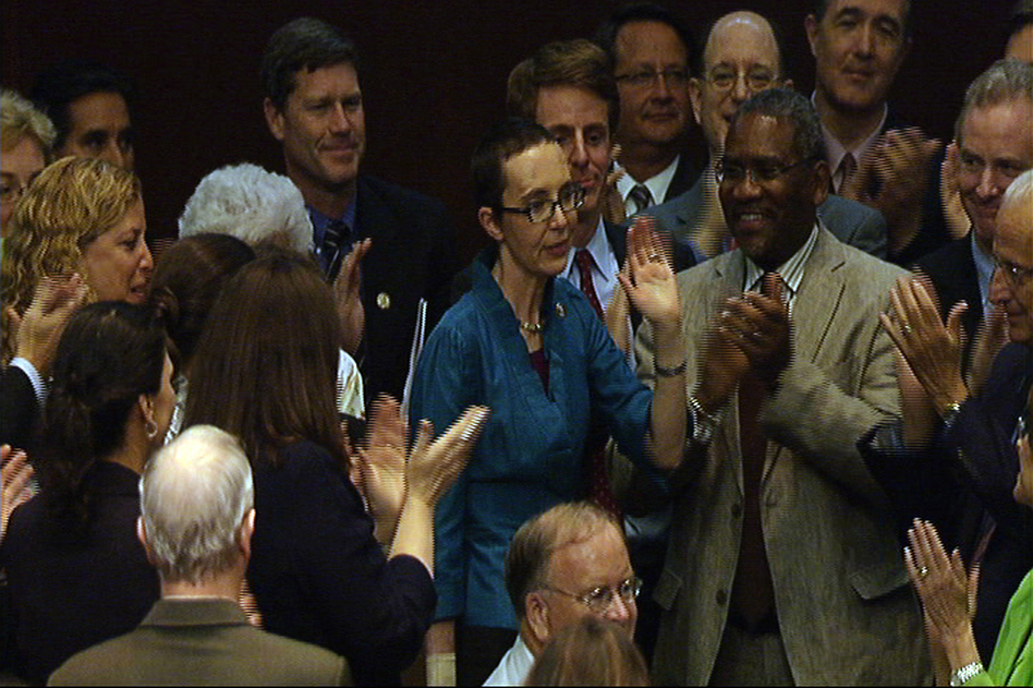 Rep. Gabrielle Giffords (D-AZ) waves to her House colleagues after voting for a bill to raise the federal debt ceiling, in this image from House Television. (AP)