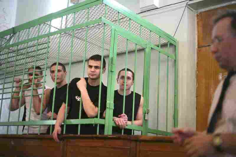 Five Muslim teenagers wait inside a courtroom cage in Kazan, Russia, in 2006. Prosecutors said the teenagers were involved in a failed terrorist plot to disrupt millennial celebrations in the city along the Volga River. 