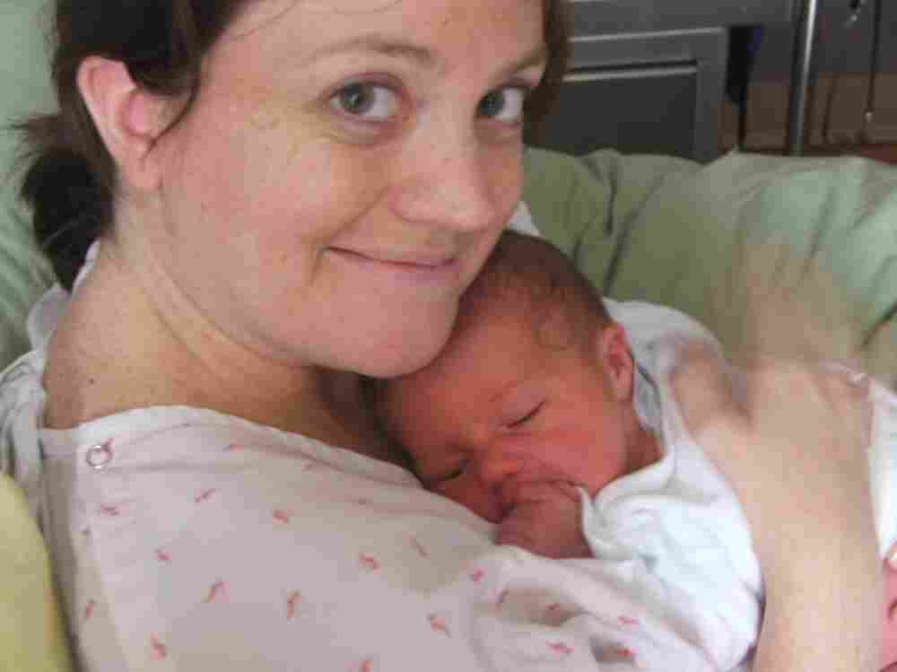 Lucy holds her newborn son, Dexter.