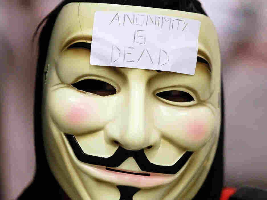 A demonstrator wears a mask during a protest inside the Bay Area Rapid Transit (BART).