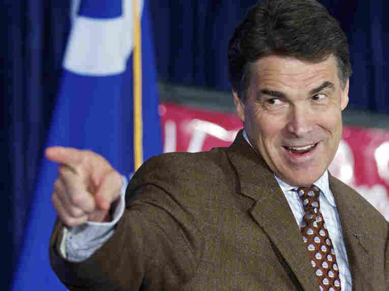 Republican presidential candidate, Texas Gov. Rick Perry recognizes a face in the crowd as he takes the stage to speak to members of the South Carolina GOP during a lunch in Columbia, S.C., on Aug. 19.
