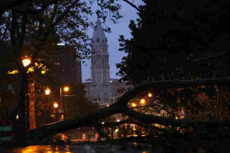 A downed tree blocks a section of the Benjamin Franklin Parkway leading to City Hall in Philadelphia. 