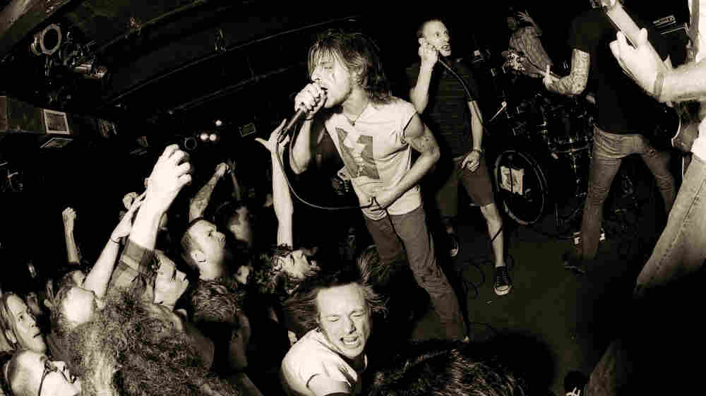 Chris Taylor (center) and Bryan Funck (Thou's vocalist, stepping in for Blake Midgette) of pg. 99 perform at the Black Cat.
