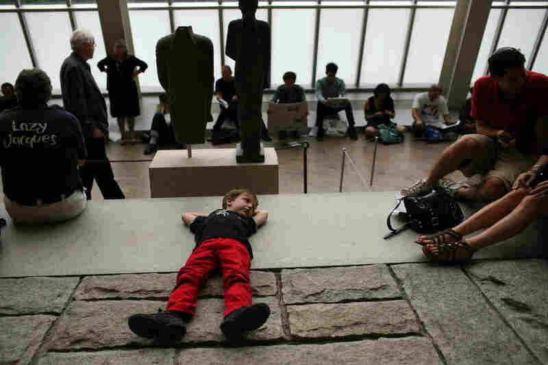 Julian Donas Milstein, 6, relaxes before the Remembering September 11 concert, at The Temple of Dendur at The Metropolitan Museum of Art in Manhattan, NY on September 11, 2011.