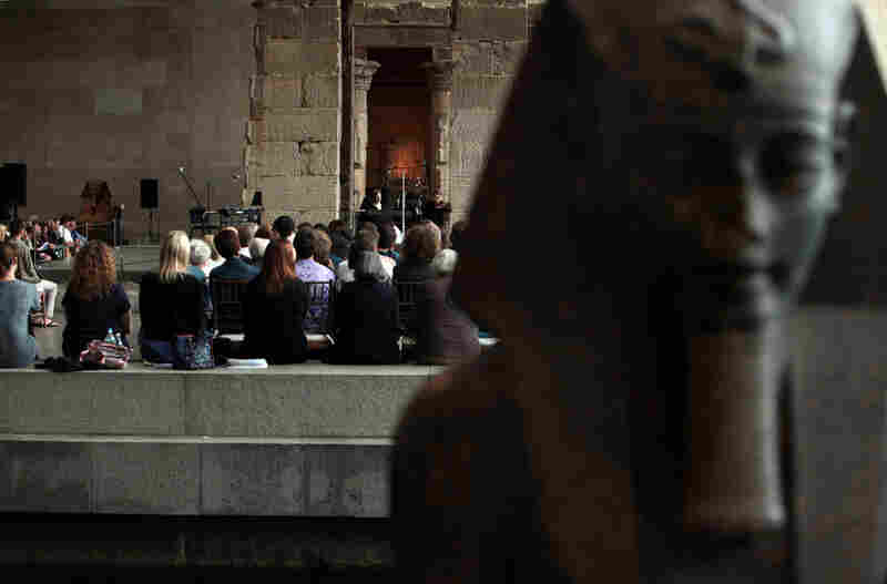 The audience, from across the reflecting pool, at the Remembering September 11 Wordless Music Orchestra concert at The Metropolitan Museum of Art in Manhattan, NY on September 11, 2011.