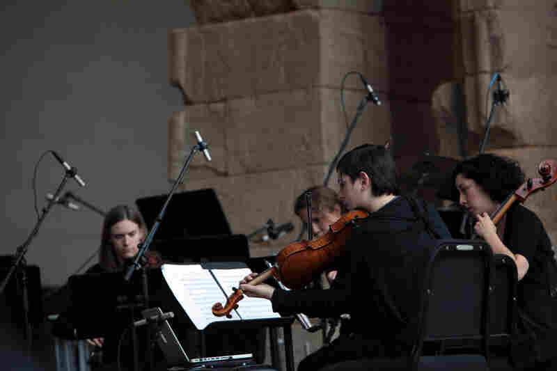 The quartet plays "Tenebrae" by Osvaldo Golijov at the Remembering September 11 concert by the Wordless Music Orchestra conducted by Ryan McAdams presented at The Temple of Dendur at The Metropolitan Museum of Art in Manhattan, NY on September 11, 2011.