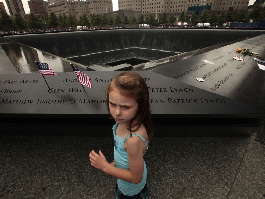 Keri McMorrow, 7, visits the memorial pool where her uncle's name is engraved, during tenth anniversary ceremonies of the September 11, 2001 terrorist attacks at the World Trade Center site.