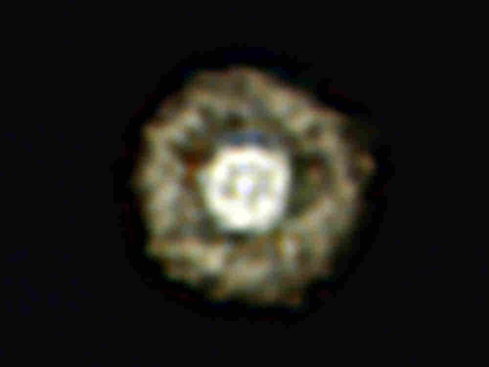 This picture of the nebula around a rare yellow hypergiant star called IRAS 17163-3907 is the best ever taken of a star in this class and shows for the first time a huge dusty double shell surrounding the central hypergiant. The star and its shells resemble an egg white around a yolky center, leading astronomers to nickname the object the Fried Egg Nebula.