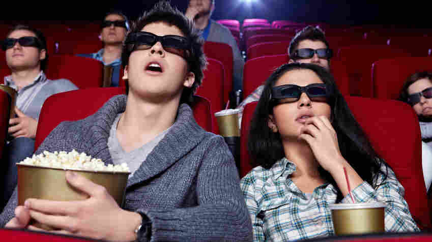 People watching a movie in 3D.
