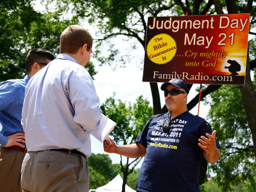 <p>On the National Mall in Washington, D.C., in May, David Liquori (right) talks with passersby. </p> (NPR)