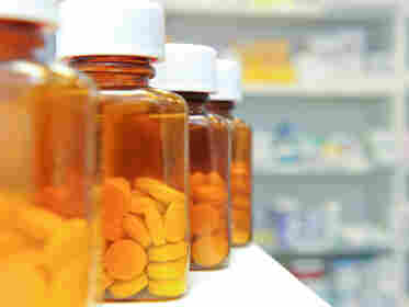 A row of pill bottles