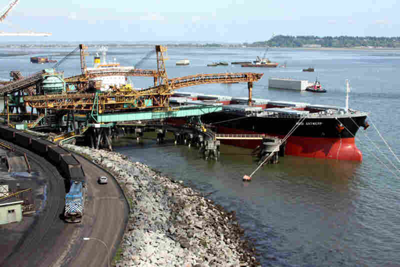 Conveyors load the coal from the trains onto ships bound for Asia. Coal produces huge amounts of carbon dioxide when it's burned, and federal climate policy is silent on this potentially large source of emissions. 