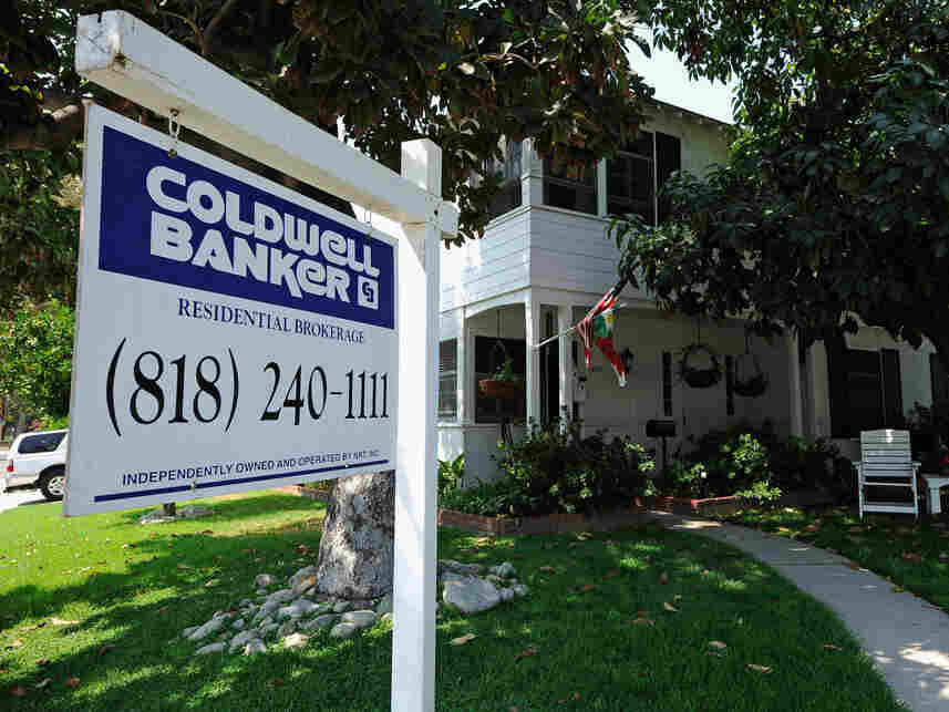 A for sale sign is posted in front of a house in Glendale, California.