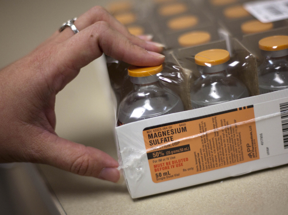 <p>A pharmacy buyer at the University of Utah Hospital in Salt Lake City holds a tray of magnesium sulfate, a drug in short supply. </p> (Jim Urquhart/AP)