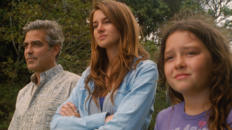 <strong>Island Son:</strong> George Clooney (left, with Shailene Woodley and Amara Miller) navigates tricky territory as a Hawaii man whose wife is on life support. (Fox Searchlight Pictures)