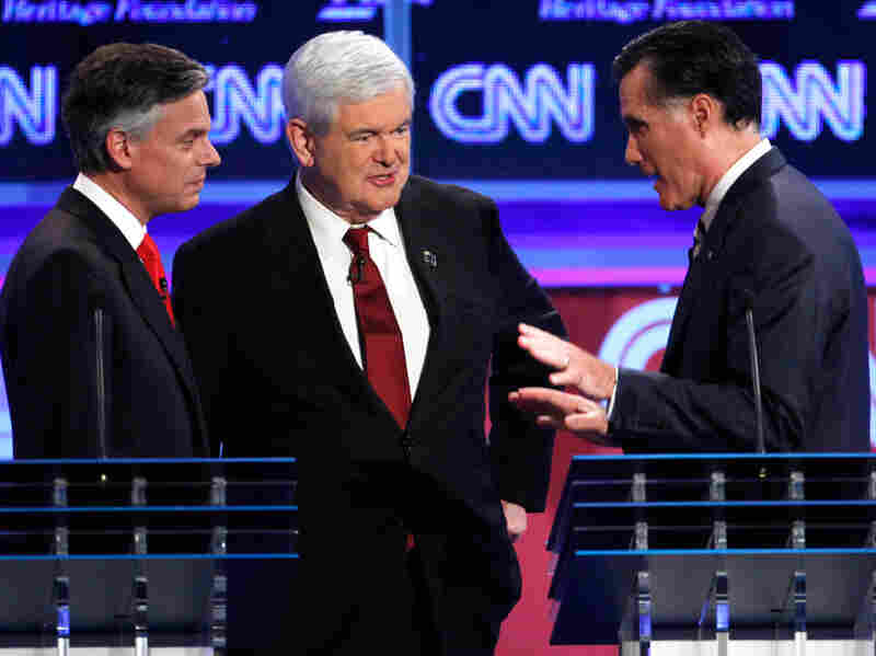 Republican presidential candidates former Utah Gov. Jon Huntsman, former House Speaker Newt Gingrich and former Massachusetts Gov. Mitt Romney at a GOP presidential debate in Washington on Nov. 22, 2011.