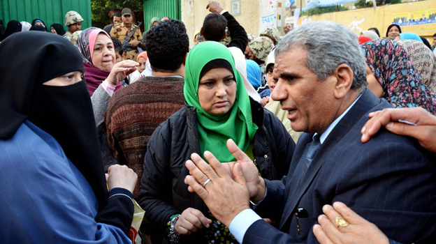 Sobhi Saleh, right, a senior member of the Muslim Brotherhood and candidate for parliament, speaks to voters at a polling station in Alexandria, Egypt on Monday. The Brotherhood is expected to make a strong showing in the polls. Sobhi Saleh, right, a senior member of the Muslim Brotherhood and candidate for parliament, speaks to voters at a polling station in Alexandria, Egypt on Monday. The Brotherhood is expected to make a strong showing in the polls.