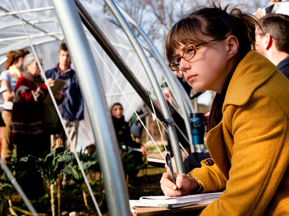 Maryland farmer Josie Johnson listens to a lecture on extending the farming season using caterpillar tunnels. The lesson was part of a conference for young farmers held in Tarrytown N.Y., in early December. (Maggie Starbard/NPR)
