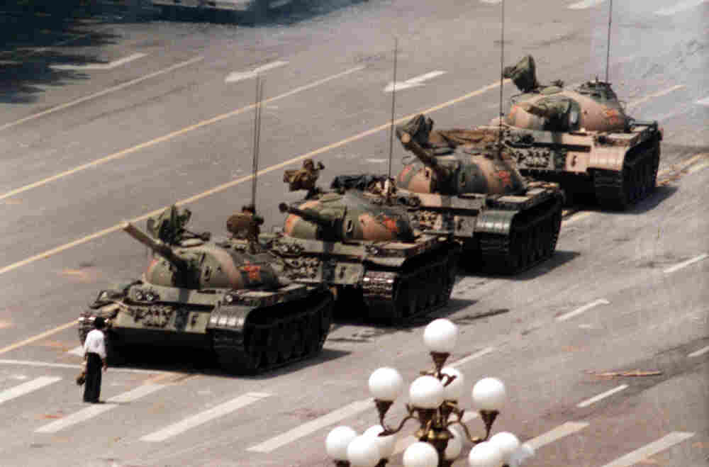 A Chinese protestor blocks a line of tanks June 5, 1989. The man, calling for an end to the violence and bloodshed against pro-democracy demonstrators at Tiananmen Square.