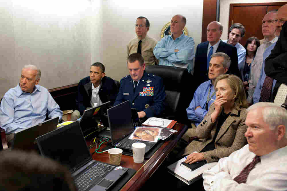 President Obama, Vice President Biden and members of the president's national security team receive an update on the mission against Osama bin Laden in the Situation Room of the White House. A classified document seen in this photograph has been obscured.