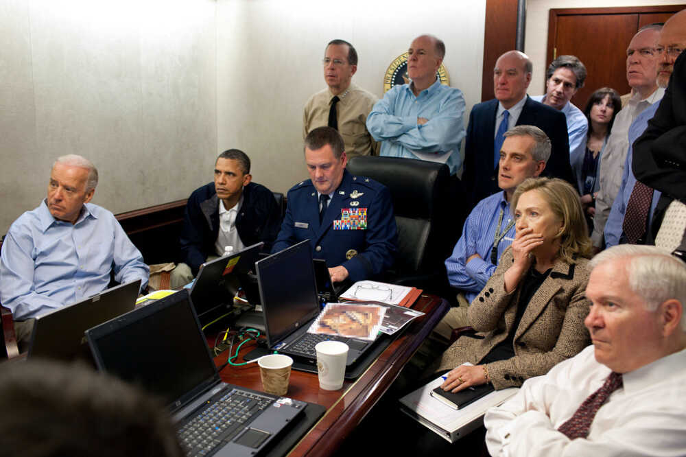President Obama, Vice President Biden and members of the president's national security team receive an update on the mission against Osama bin Laden in the Situation Room of the White House. A classified document seen in this photograph has been obscured.