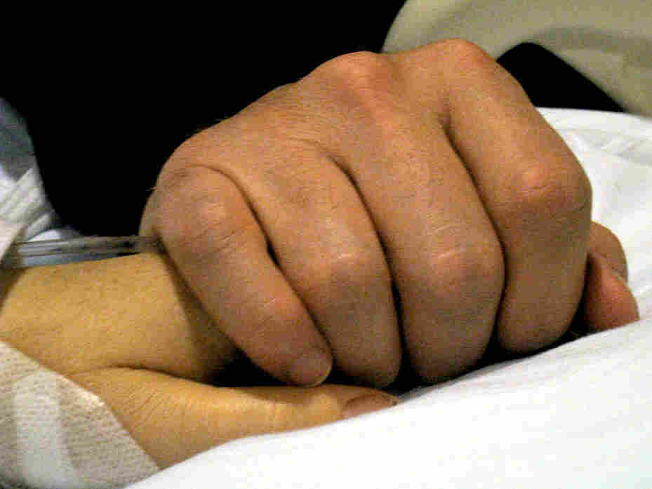The hands of Mark Kelly and Rep. Gabrielle Giffords.