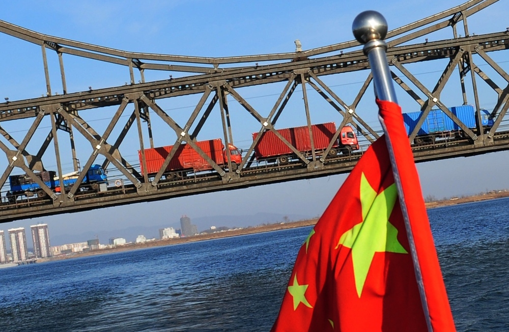 Trucks loaded with Chinese goods head across the Yalu Bridge and into North Korea one day after the memorial service for the late leader Kim Jong Il, at the Chinese North Korean border town of Dandong on December 30, 2011. (AFP/Getty Images)