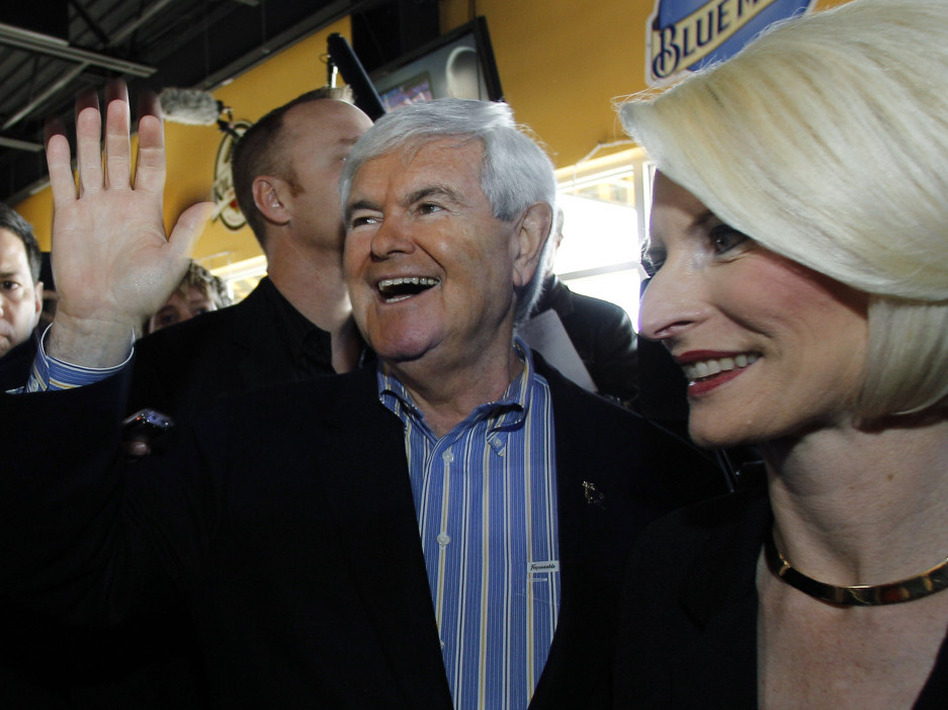 Former House speaker Newt Gingrich and wife, Callista, campaigned on New Year's Day in Ames, Iowa. (Eric Gay/AP)