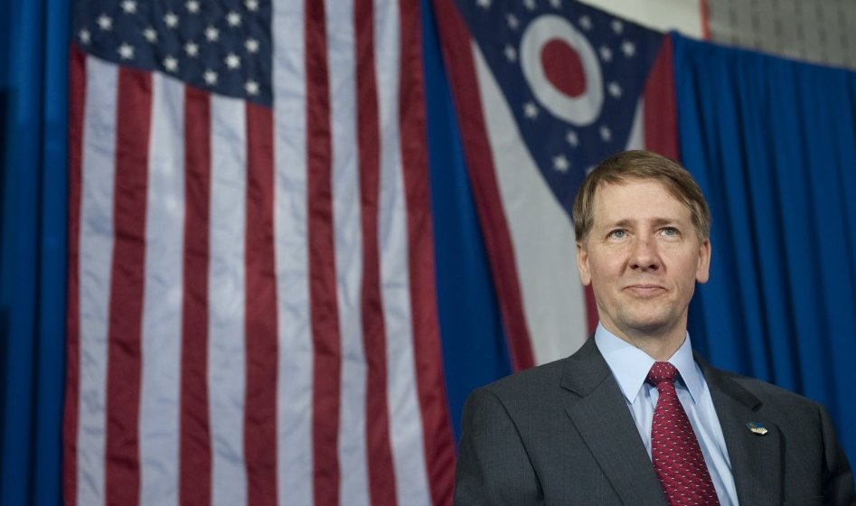 Richard Cordray, incoming head of the Consumer Financial Protection Bureau, stands offstage after President Obama spoke about the economy in Ohio on Wednesday. (AFP/Getty Images)