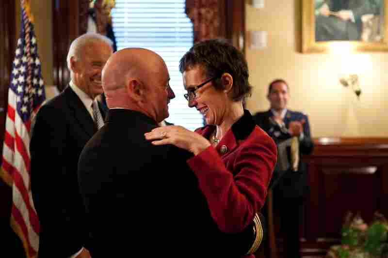 Kelly hugs his wife after receiving the Legion of Merit from Vice President Joe Biden during a retirement ceremony on Oct. 6. 