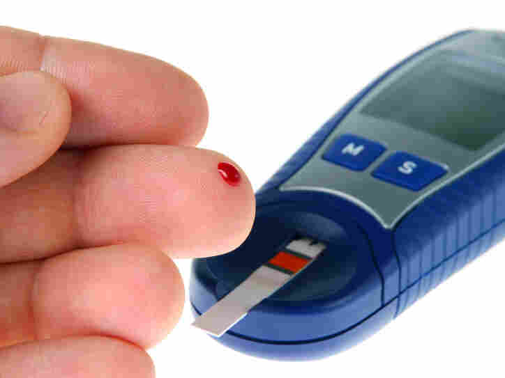 A diabetic tests his blood for glucose.