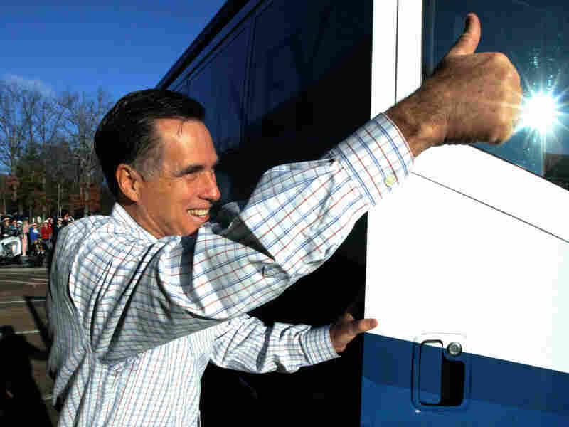 Republican presidential candidate, former Massachusetts Gov. Mitt Romney, gives a thumbs up as he gets back on his campaign bus in South Carolina.
