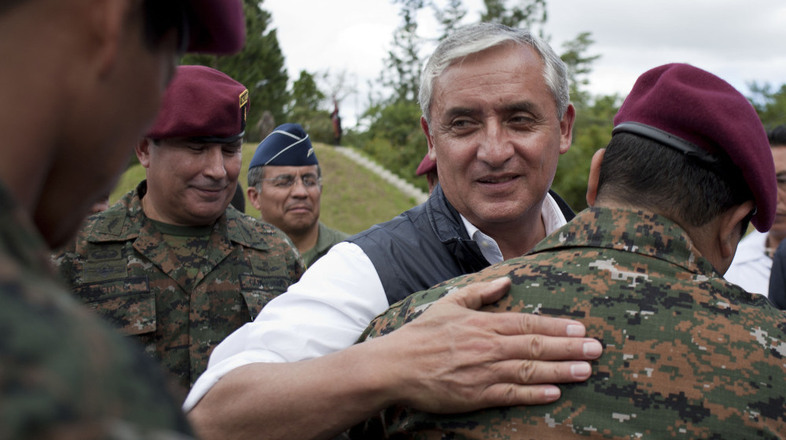 Newly elected president Otto Perez Molina greets members of Guatemala's elite special forces in December. Perez takes office Saturday with a top priority of ending a long-standing U.S. ban on military aid. (Moises Castillo/AP)