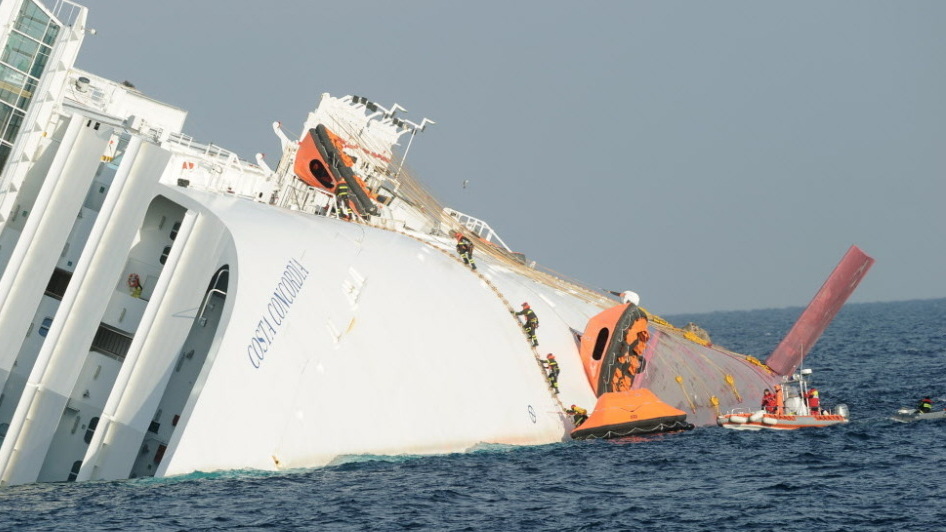 Searchers climbing on to the Costa Concordia earlier today (Jan. 19, 2012). (AFP/Getty Images)