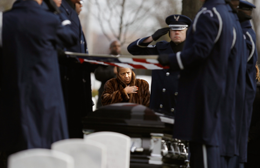 Family, friends and admirers salute the casket of Luke Weathers, Jr., one of the original Tuskegee airmen, at his burial ceremony at Arlington National Cemetery. (Getty Images)