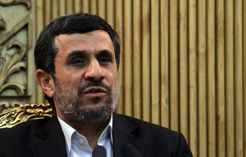 Iranian President Mahmoud Ahmadinejad speaks to the press prior upon his arrival at Tehran's Mehrabad Airport on Jan. 14. (Atta Kenare/AFP/Getty Images)