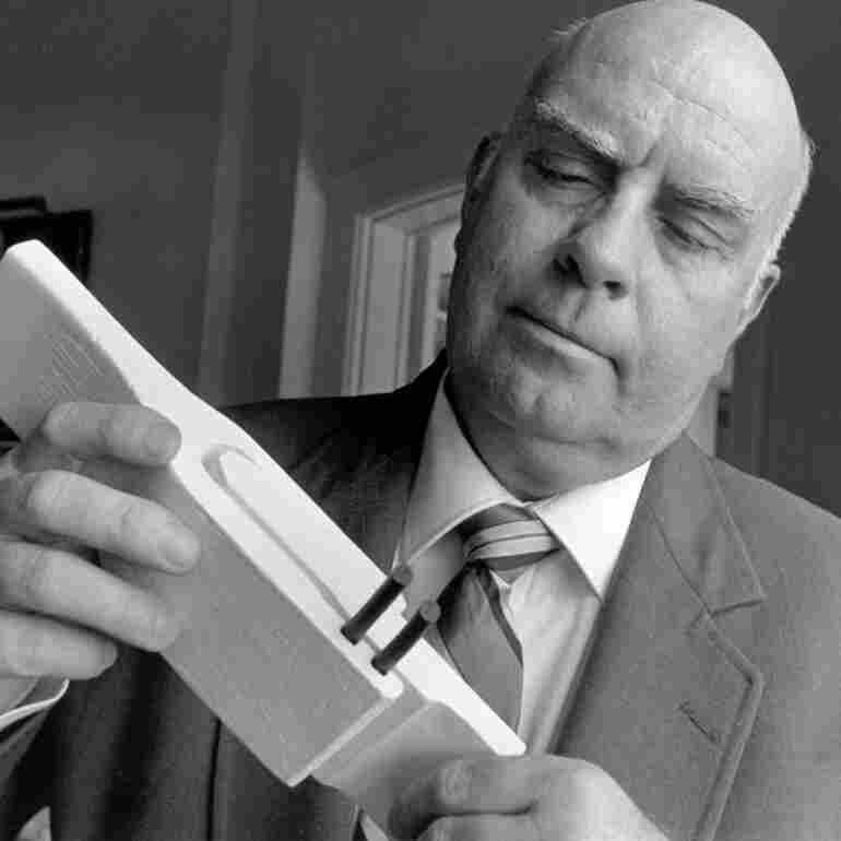 Engineer Roger Boisjoly examines a model of the O-Rings, used to bring the Space Shuttle into orbit, at a meeting of senior executives and academic representatives in Rye, New York in Sept. 1991.
