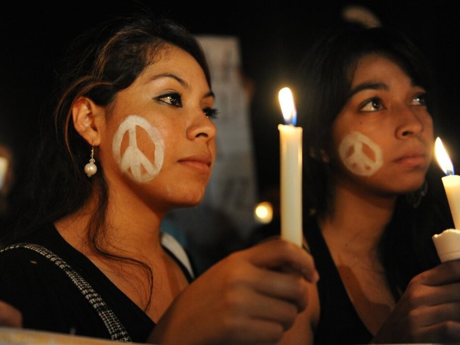 University students take part in a wake against violence held in Tegucigalpa, Honduras, in October. According to the United Nations, Honduras is the most violent country in the world. (Orlando Sierra/AFP/Getty Images)