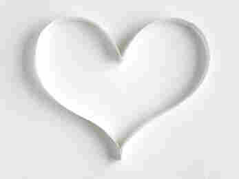 Heart made of paper on white background