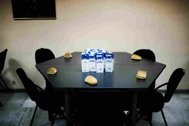 Milk and bread sit on a table at the Athenian Municipal Solidarity Center where poor families and the homeless are fed.