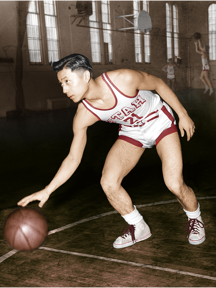 Wat Misaka dribbles the ball in a gym at the University of Utah, where he helped the Utes win the NIT in 1947. The victory drew the attention of the New York Knicks, who chose him in the draft. (The Misaka Family)