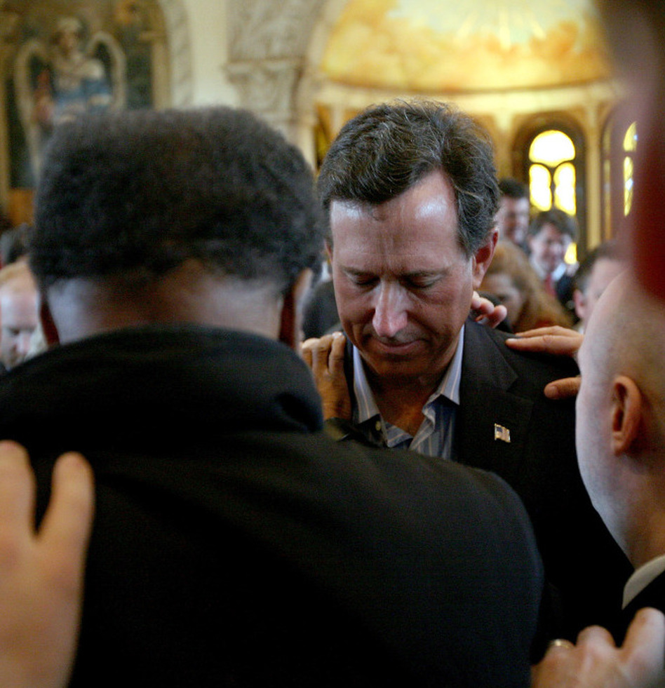 Republican presidential candidate Rick Santorum, center, and supporters as they prayed earlier this month in McKinney, Texas. (Tom Pennington/Getty Images)