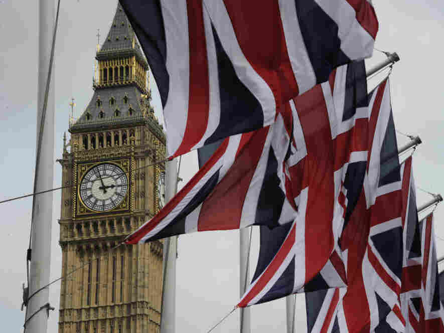 British Union Jack flags flutter in the wind next to Big Ben, in London, on April 28, 2011.
