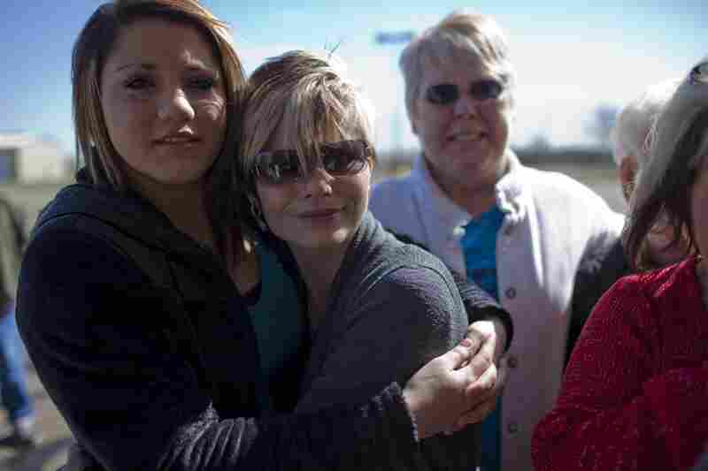 Nikki Lopez, 16, and her mother, Robin Robertson, wait outside of the Potter County Detention Center on March 2 in Amarillo, Texas. Nikki's father, Ernie Lopez, was released moments later.