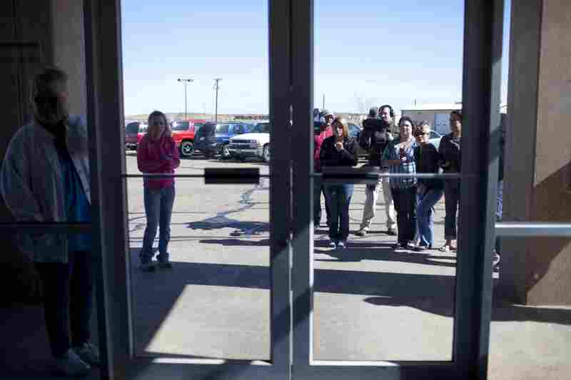 Supporters and family members of Ernie Lopez wait outside the Potter County Detention Center in Amarillo, Texas.